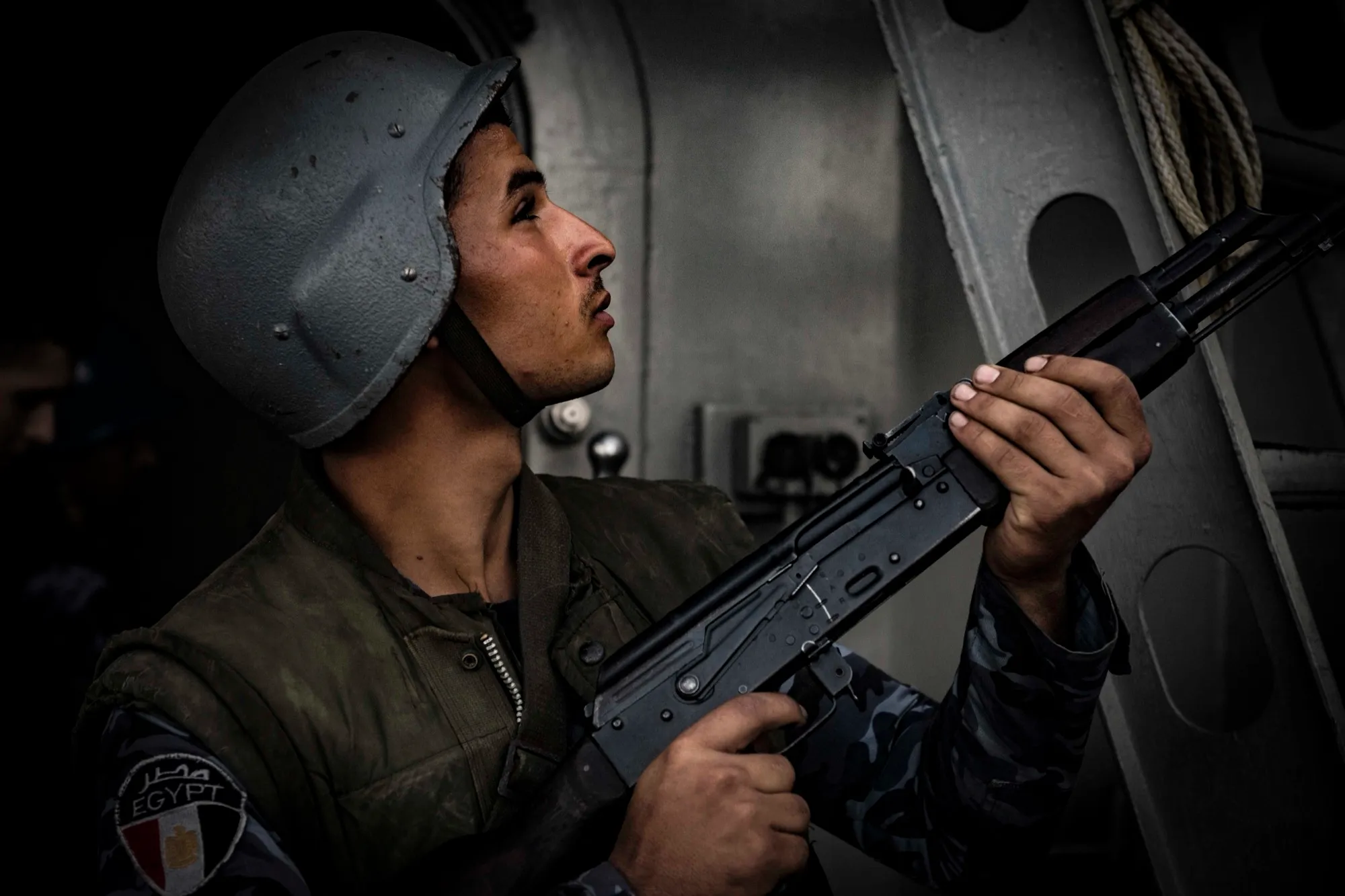 Egyptian naval infantryman looks skyward during a boarding exercise